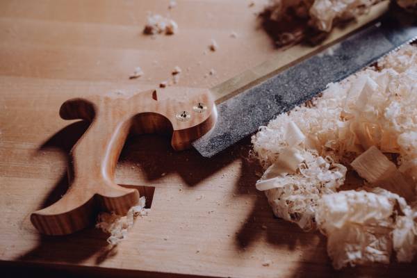 A hand saw on a table—how to cut a 45 degree angle with a hand saw