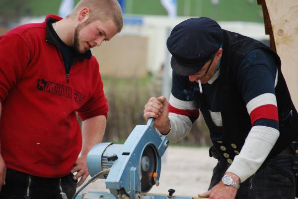 Two men working—can you cut PVC with a miter saw
